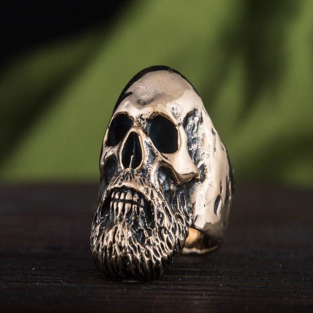 Bronze Viking bearded skull ring with intricate details.
