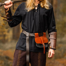 Black cotton Viking tunic with long sleeves and lace-up collar, worn with leather accessories.
