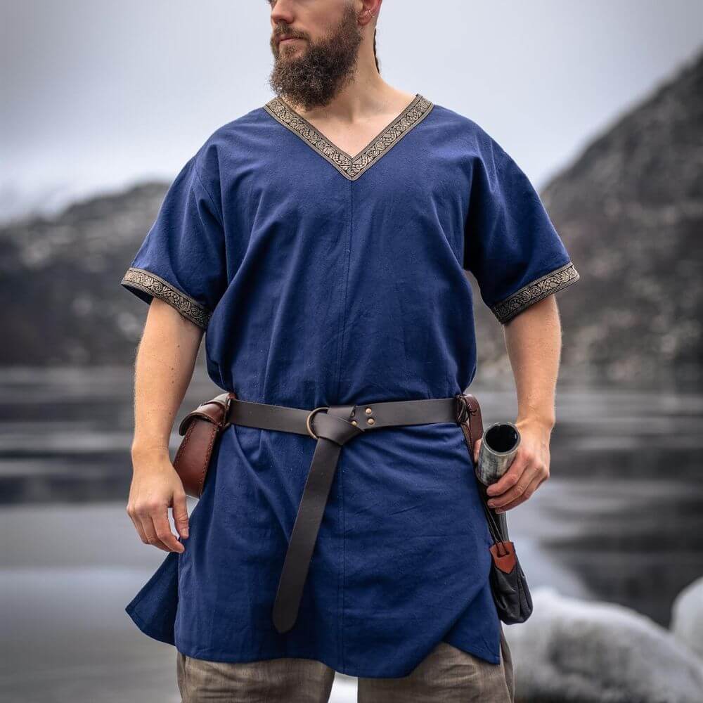 Blue Viking tunic, hip-length, with gold trim at V-neck and sleeves, worn by a bearded man.