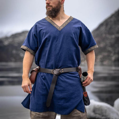 Blue Viking tunic, hip-length, with gold trim at V-neck and sleeves, worn by a bearded man.
