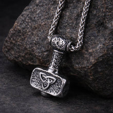 Viking Mjolnir pendant necklace: silver-toned Thor's hammer with a bold triquetra design on a chain.