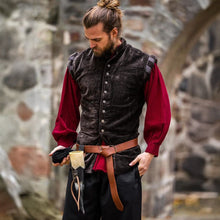 Brown velvet Viking vest with button closure over a red shirt.