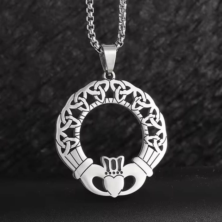 Viking Celtic Claddagh necklace with trinity knot ring, silver-toned metal, intricate design.