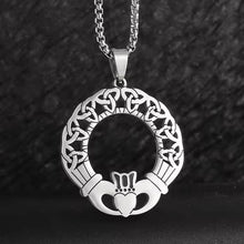 Viking Celtic Claddagh necklace with trinity knot ring, silver-toned metal, intricate design.