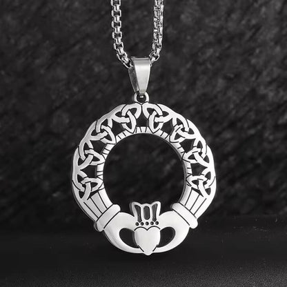 Viking Celtic Claddagh necklace with trinity knot ring, silver-toned metal, intricate design.
