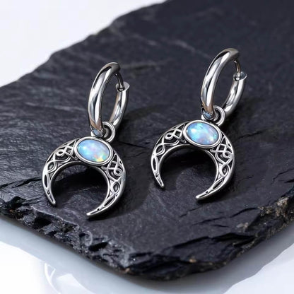 Viking Celtic crescent moon drop earrings with blue opal stone, silver-toned, intricate knotwork.