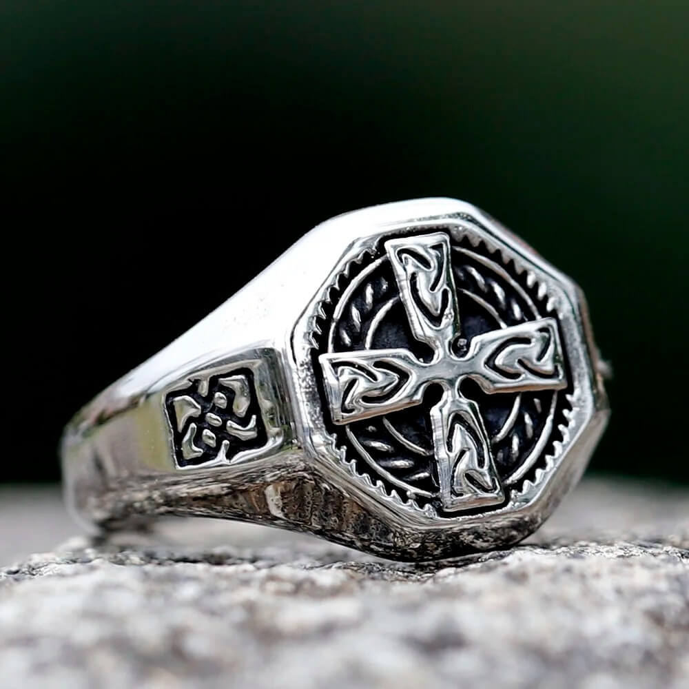 Viking silver Celtic cross signet ring with intricate knotwork on a textured band.