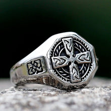 Viking silver Celtic cross signet ring with intricate knotwork on a textured band.