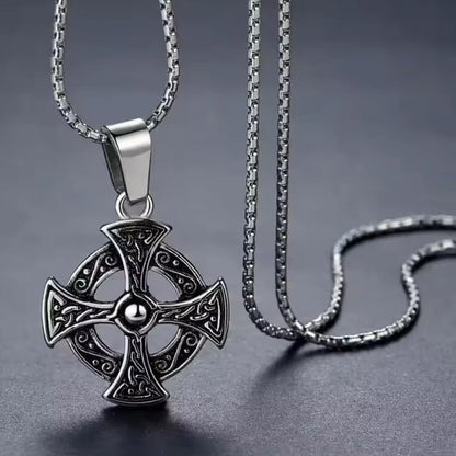 Celtic sun cross pendant necklace in antiqued stainless steel with scrollwork design on silver box chain