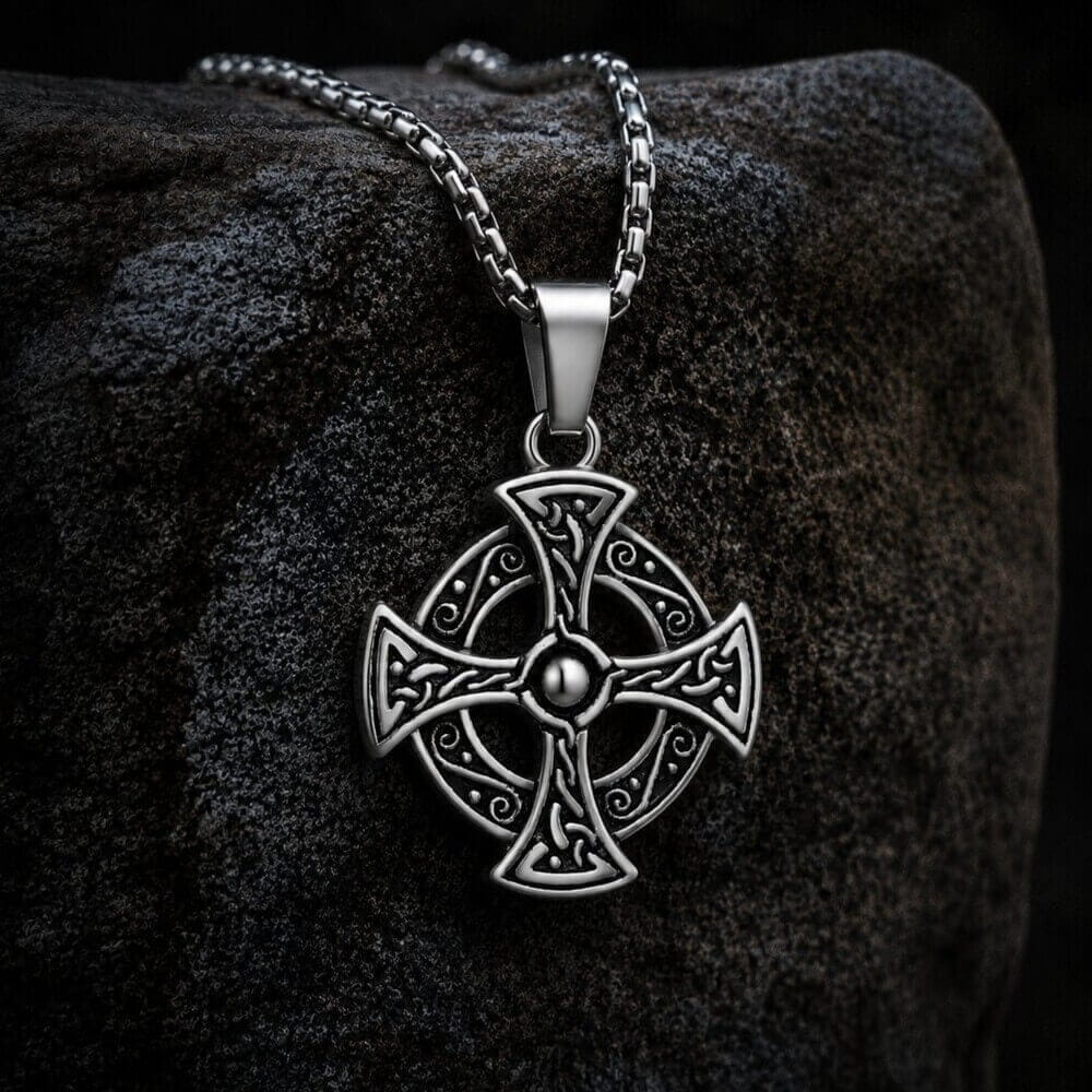 Viking Celtic Cross stainless steel pendant necklace with intricate knotwork design on a dark stone.