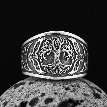 Viking silver Celtic Tree of Life ring with raven details, dark background.