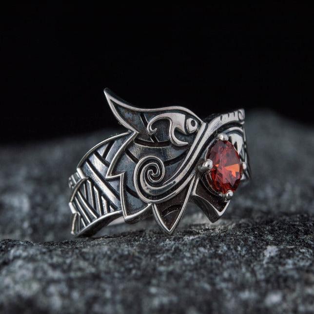 Sterling silver Viking Fenrir wolf ring with a vibrant red gem, detailed Norse design.