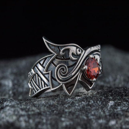 Sterling silver Viking Fenrir wolf ring with a vibrant red gem, detailed Norse design.