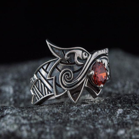 Sterling silver Viking Fenrir wolf ring with a vibrant red gem, detailed Norse design.