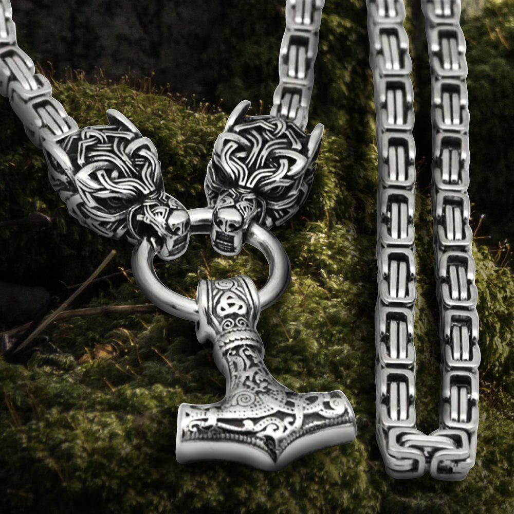 Viking Fenrir wolf head steel chain necklace with Mjolnir pendant and knotwork clasp.