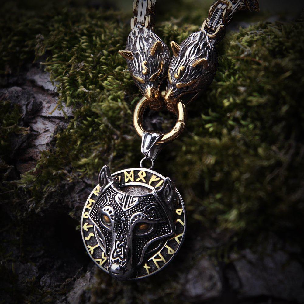 Viking Fenrir wolf medallion necklace in gold and steel with two wolf heads on a chain.