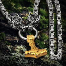 Viking gold Fenrir wolf heads with Mjolnir pendant on a steel Byzantine chain.