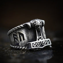 Silver Viking Hammer of Thor steel ring with intricate Mjolnir design and runic details.