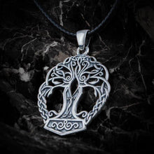 Sterling silver Viking Yggdrasil pendant with Mjolnir base on a black leather cord.