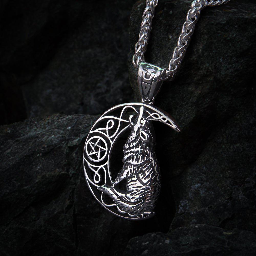 Silver Viking howling wolf and moon amulet necklace with intricate knotwork.