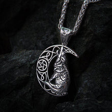 Silver Viking howling wolf and moon amulet necklace with intricate knotwork.