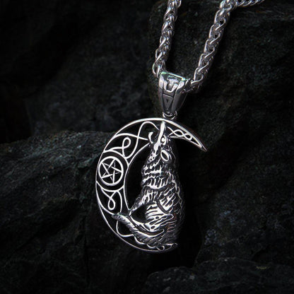 Silver Viking howling wolf and moon amulet necklace with intricate knotwork.