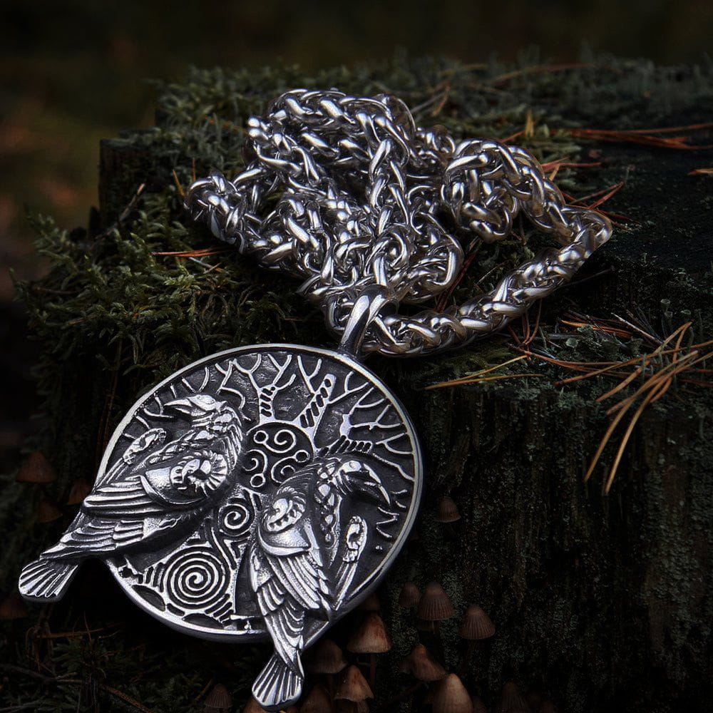 Silver Viking raven amulet necklace with Huginn and Muninn design, intricate tree, and thick chain.