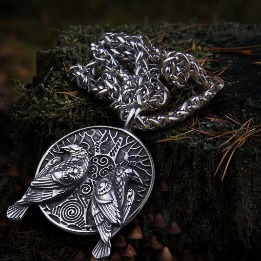 Silver Viking raven amulet necklace with Huginn and Muninn design, intricate tree, and thick chain.