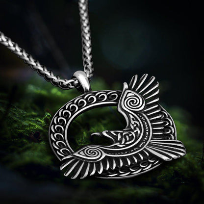 Viking Huginn and Muninn raven amulet necklace in silver-toned metal with intricate Celtic knotwork design.