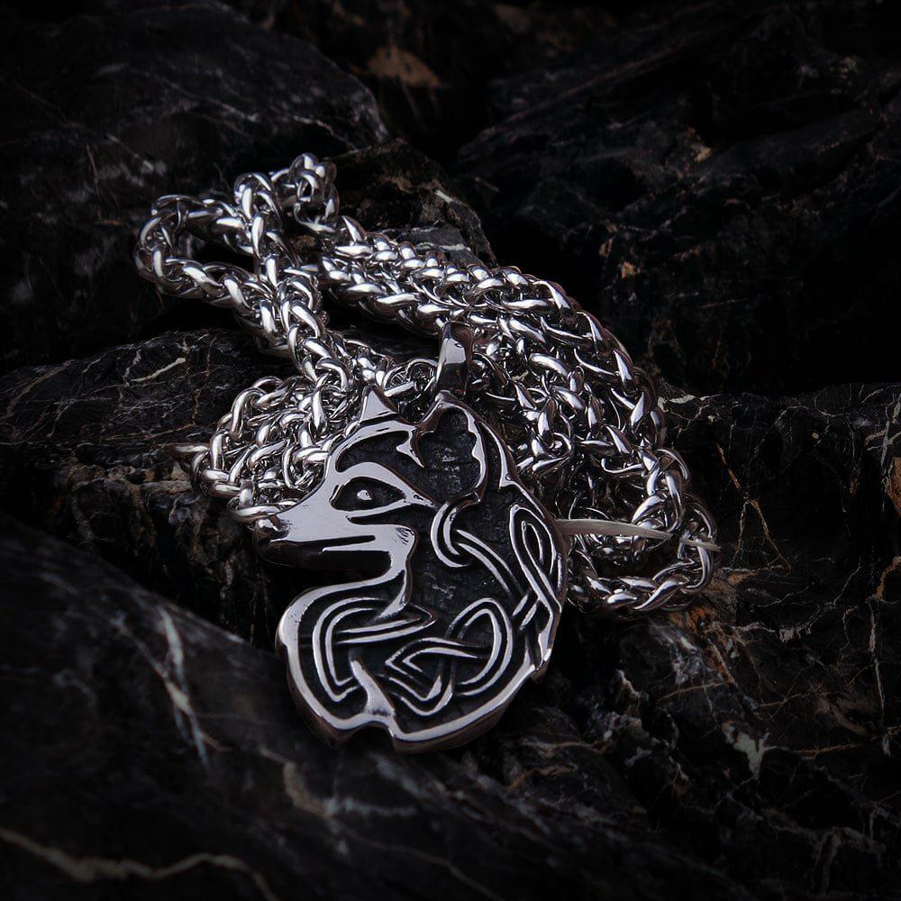 Viking knotwork fox totem steel necklace with intricate silver design on a dark background.