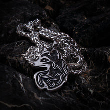 Viking knotwork fox totem steel necklace with intricate silver design on a dark background.