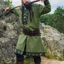 Viking tunic: green with black leather trim, lacing, and rivets.
