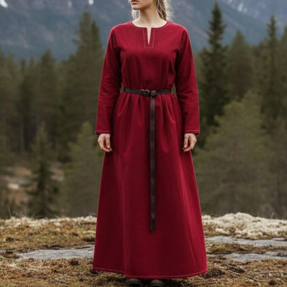 Viking rich red long-sleeved dress with a V-neck and dark belt, set against a forest backdrop.