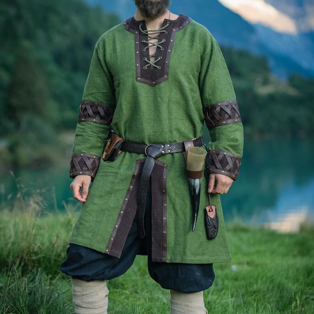 Green Viking tunic with ornate brown leather trim, lacing, and rivets.
