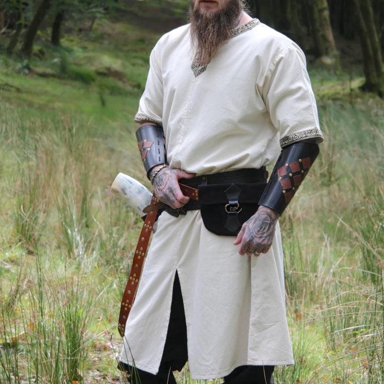 Natural linen Viking tunic with short sleeves and embroidered border.