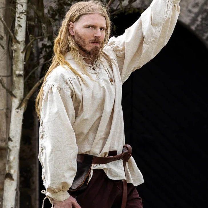 Natural white Viking stand-up collar lace-up shirt with adjustable sleeves, worn by a man.