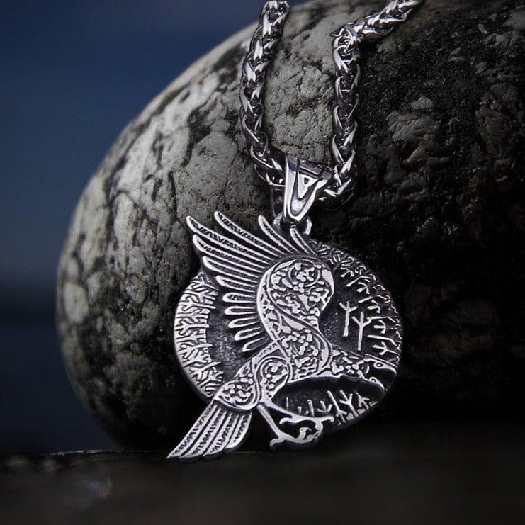 Silver Viking raven and runes talisman necklace with detailed circular pendant.