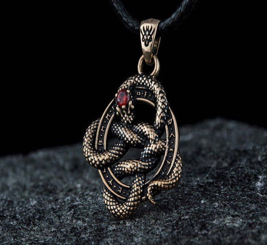 Viking bronze snake pendant with red CZ eye, encircled by Norse runes on a black cord.