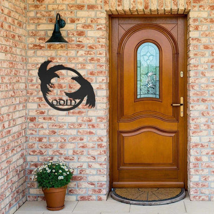 Black metal Viking sign featuring two ravens encircling "ODIN" on a brick wall.