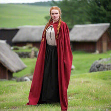 Red Viking summer-weight cotton cloak with hood, worn by a woman with braided red hair.