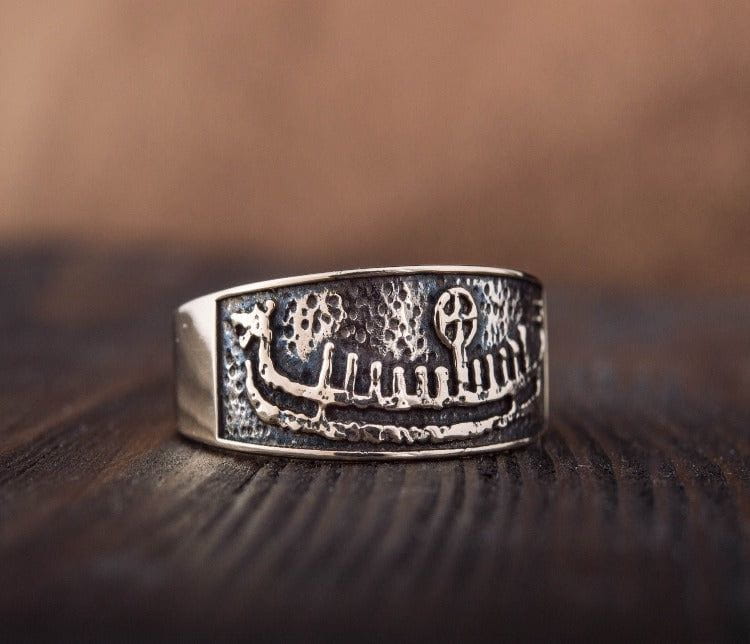 Bronze Viking ring with a detailed drakkar ship design, handcrafted Norse style.