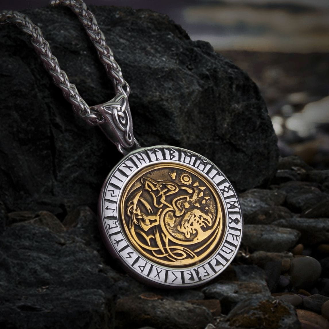 Viking steel Fenrir wolf rune pendant with gold rotating center on a braided chain.