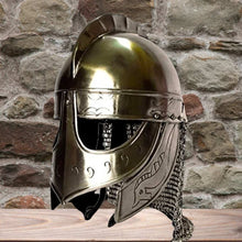 Shiny steel Viking Valsgarde helm with chainmail, intricate engravings, and a prominent crest.