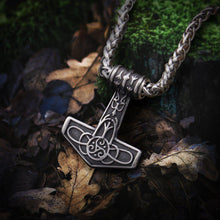 Viking steel Thor's Hammer Mjolnir necklace with delicate triskele knotwork, gold accents, and a braided chain.