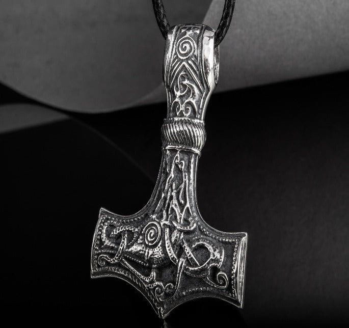Sterling silver Viking Thor's Hammer Mjolnir pendant with intricate Mammen-style knotwork on a black cord.
