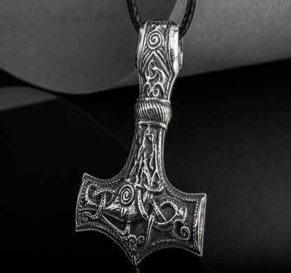 Sterling silver Viking Thor's Hammer Mjolnir pendant with intricate Mammen-style knotwork on a black cord.