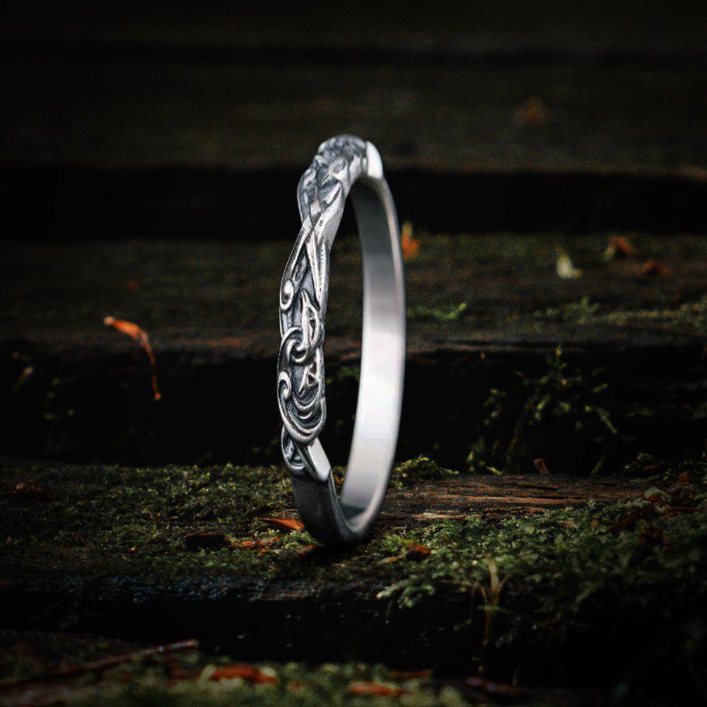 Sterling silver Viking raven ring with intricate knotwork design.