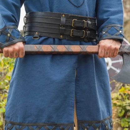 Black double-design thick leather Viking belt with buckles, worn over a blue tunic, holding an axe.