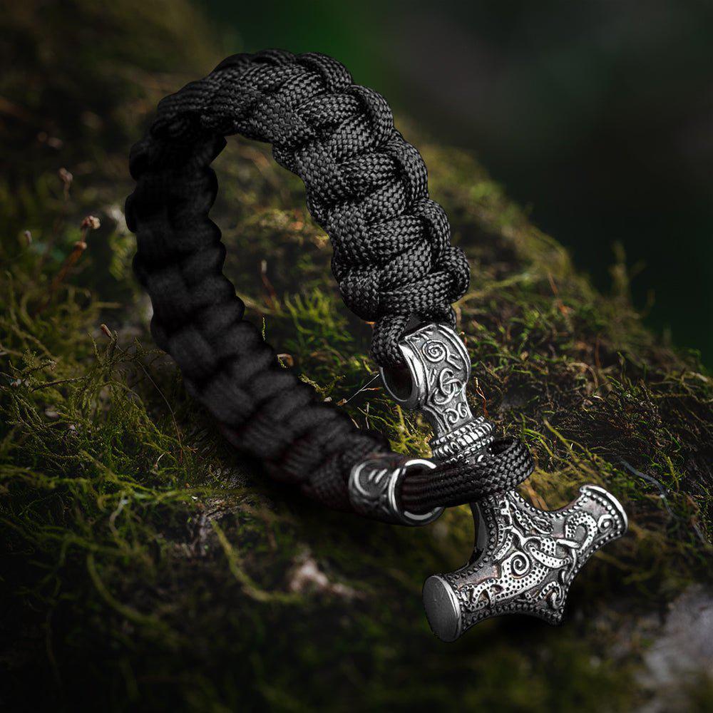 Viking Thor's Hammer bracelet with black braided paracord and detailed silver-tone Mjolnir pendant.