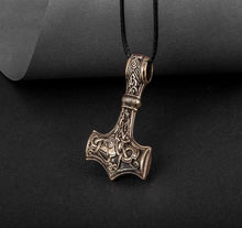 Bronze Viking Thor's Hammer Mjolnir pendant with intricate Mammen style knotwork on a black cord.